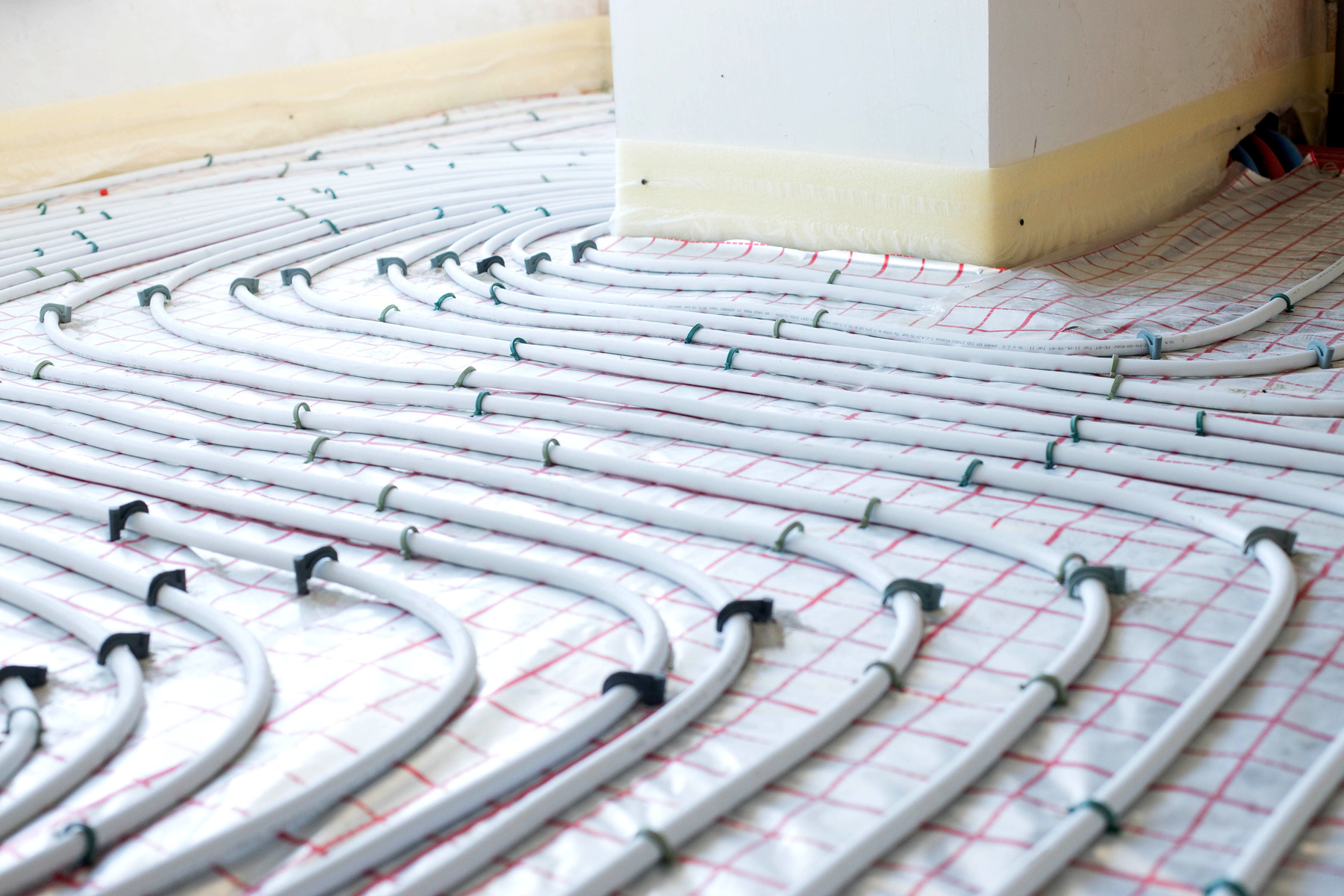 Installation of underfloor heating pipes for water heating. Heating systems. Pipes for underfloor heating.
